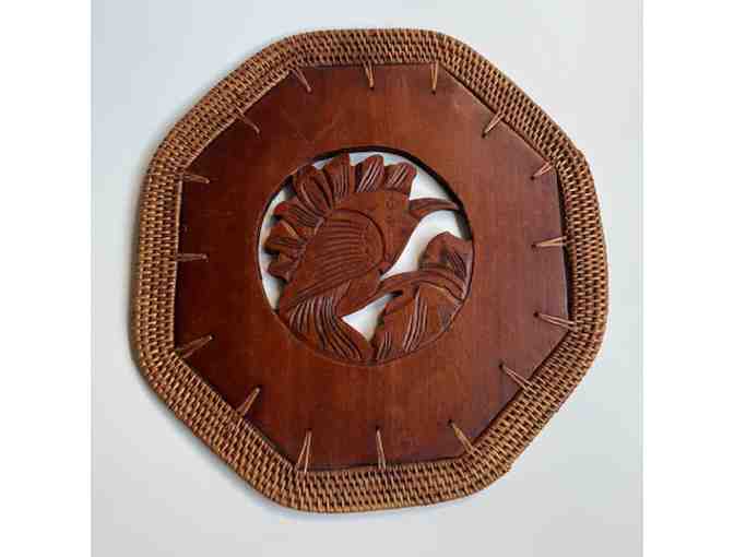 Two plaques with images of birds, carved of teakwood with rattan border